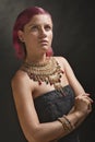 Beautiful red-haired young woman wearing a royal jewelry necklac