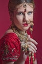 Beautiful red-haired young woman wearing a royal jewelry necklac