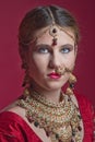 Beautiful red-haired young woman wearing a royal jewelry necklac