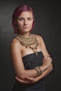 Beautiful red-haired young woman wearing a royal jewelry necklac