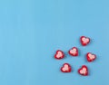 Beautiful red hearts on blue background. Valentines day concept flat lay