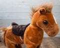 A beautiful red horse with a saddle kid toy Royalty Free Stock Photo