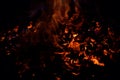 Beautiful red hot glowing ember pile with colorful flames Royalty Free Stock Photo