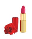 Beautiful red lipstick in golden tube and red rose