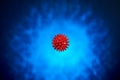 Beautiful red massage ball with spikes for stimulation and circulation, hangs in the air on the dark blue background. relaxation,