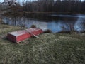 Beautiful red old red boat beside pond Royalty Free Stock Photo