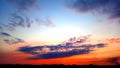 Beautiful red and orange sunset. Blue sky with cirrus clouds. Skyline land with forest bottom. For wallpapers and backgrounds Royalty Free Stock Photo