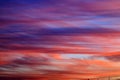 Beautiful red, pink and blue feather clouds against the sky in sunrise, magic romantic background