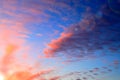 Beautiful red, pink. blue. orange unusual feather clouds against the sky in sunrise, sunset, romantic background. Scenic Royalty Free Stock Photo
