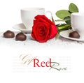 Beautiful red rose and cup of hot tea with chocolate Royalty Free Stock Photo