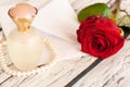 Beautiful red rose string of pearls perfume bottle and letter envelope love valentine`s day Royalty Free Stock Photo