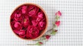 Rose flower arrangement on check background, floating on water Royalty Free Stock Photo