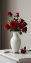 Red roses vase on white table light background Royalty Free Stock Photo