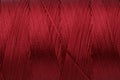 Beautiful red sewing thread as background, closeup Royalty Free Stock Photo