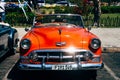 A beautiful red classic car in Havana, Cuba.