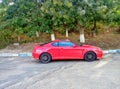 Beautiful red sports car standing on the road Royalty Free Stock Photo