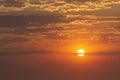 Beautiful red sunset, dark clouds on the horizon