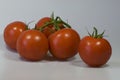 Beautiful red tomatoes, yellow peppers in a group and individually