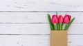 Beautiful red tulips spring flowers decoration on white wood for Mothers Day or Valentines Day Royalty Free Stock Photo