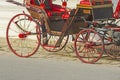 Beautiful red wheels of old wagon on the road