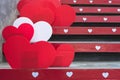 Beautiful Red and white heart shape made from corrugated plastic sheets decorate on the stairs on the occasion of the Valentine`