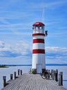 Red-white lighthouse on Lake Neusiedlersee in Podersdorf, Austria