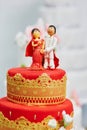 Beautiful red and yellow wedding cake in Indian style Royalty Free Stock Photo