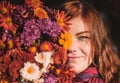 Beautiful redhaired girl with a flowers.