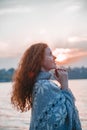 Beautiful red-haired girl at sunset. Royalty Free Stock Photo