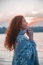 Beautiful red-haired girl at sunset. Royalty Free Stock Photo