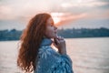 Beautiful red-haired girl at sunset. Royalty Free Stock Photo