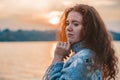 Beautiful redhaired girl at sunset.