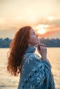 Beautiful redhaired girl at sunset. Royalty Free Stock Photo