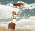 Beautiful redhead girl with umbrella and suitcase at outdoor. Royalty Free Stock Photo