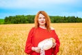 Beautiful redhead girl in wheat field Royalty Free Stock Photo