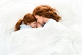 beautiful redhead mother and daughter sleeping together Royalty Free Stock Photo