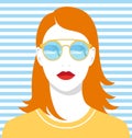 Beautiful redhead woman with golden mirrored sunglasses