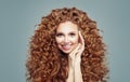 Beautiful redhead woman with long curly hair isolated on white. Haircare concept Royalty Free Stock Photo