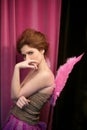 Beautiful redhead woman with pink wings Royalty Free Stock Photo