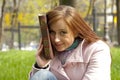 Beautiful redhead woman reading book Royalty Free Stock Photo