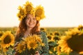 Beautiful redhead woman in sunflower field on sunny day Royalty Free Stock Photo