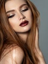 Beautiful redhead woman touching her face Royalty Free Stock Photo