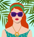 Beautiful redhead woman wearing large fashionable sunglasses