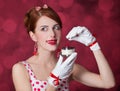 Beautiful redhead women with candy. Royalty Free Stock Photo