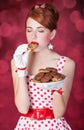 Beautiful redhead women with coockie Royalty Free Stock Photo