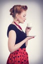 Beautiful redhead women with cup of tea. Royalty Free Stock Photo