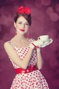 Beautiful redhead women with cup of tea. Royalty Free Stock Photo