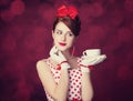 Beautiful redhead women with cup of tea. Royalty Free Stock Photo