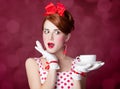 Beautiful redhead women with cup of tea. Royalty Free Stock Photo