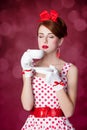 Beautiful redhead women with cup of tea. Royalty Free Stock Photo